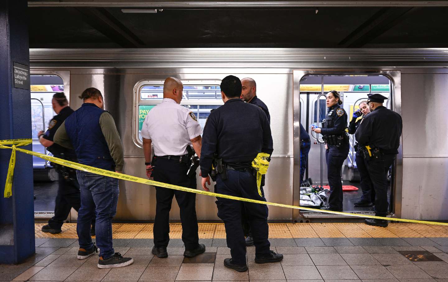 Jordan Neely lies unconscious on the floor of the F train after another passenger placed him in a chokehold on Monday, May 1, 2023, in New York.
