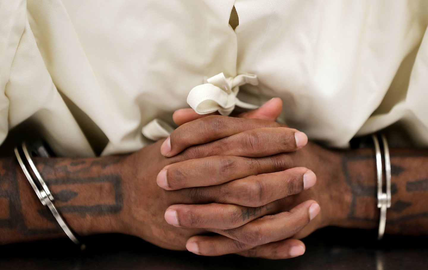 A prisoner is shackled while attending a class for mental health in the Short-Term Restricted Housing Unit at California State Prison, Sacramento.