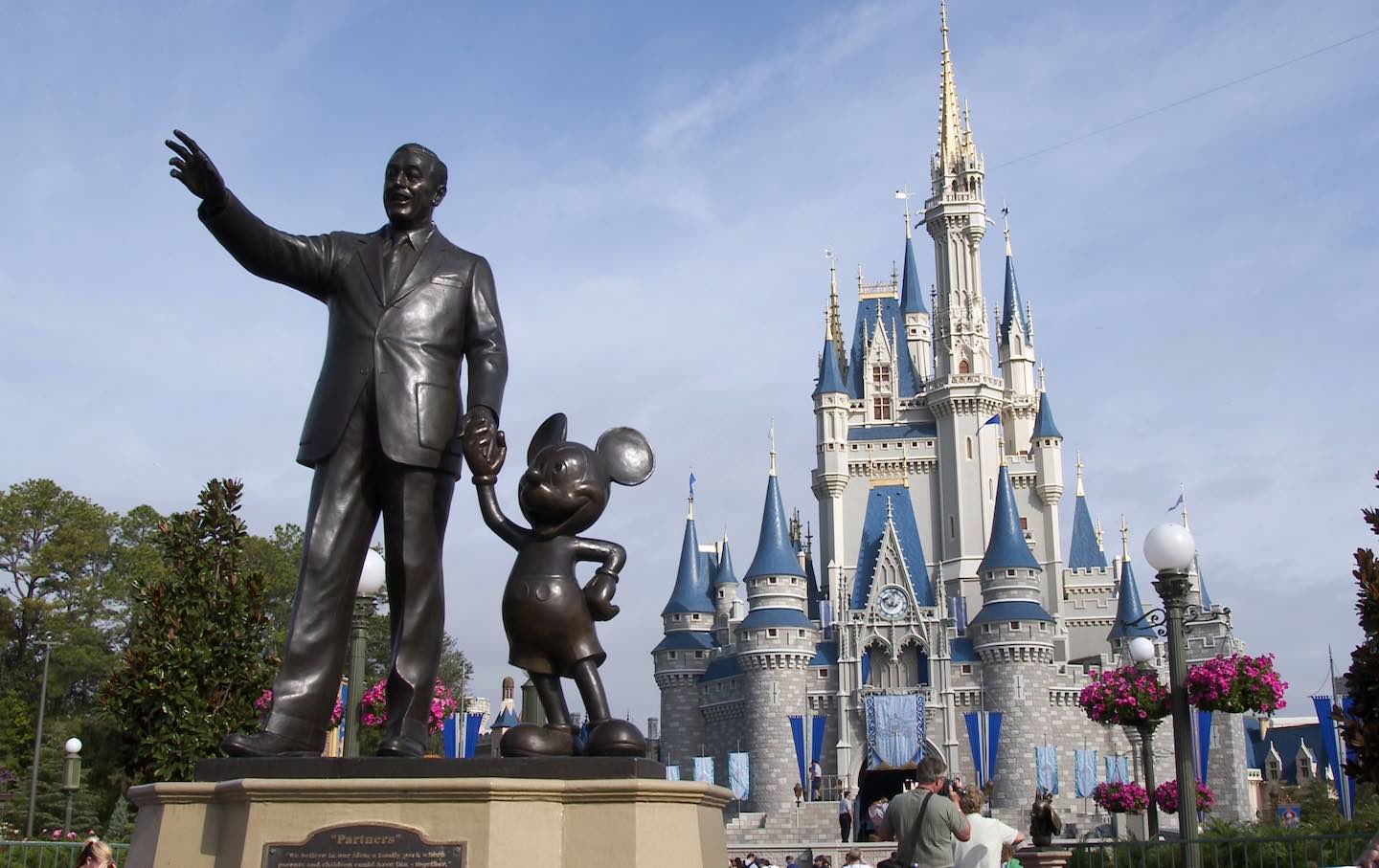 A statue of Walt Disney and Mickey Mouse
