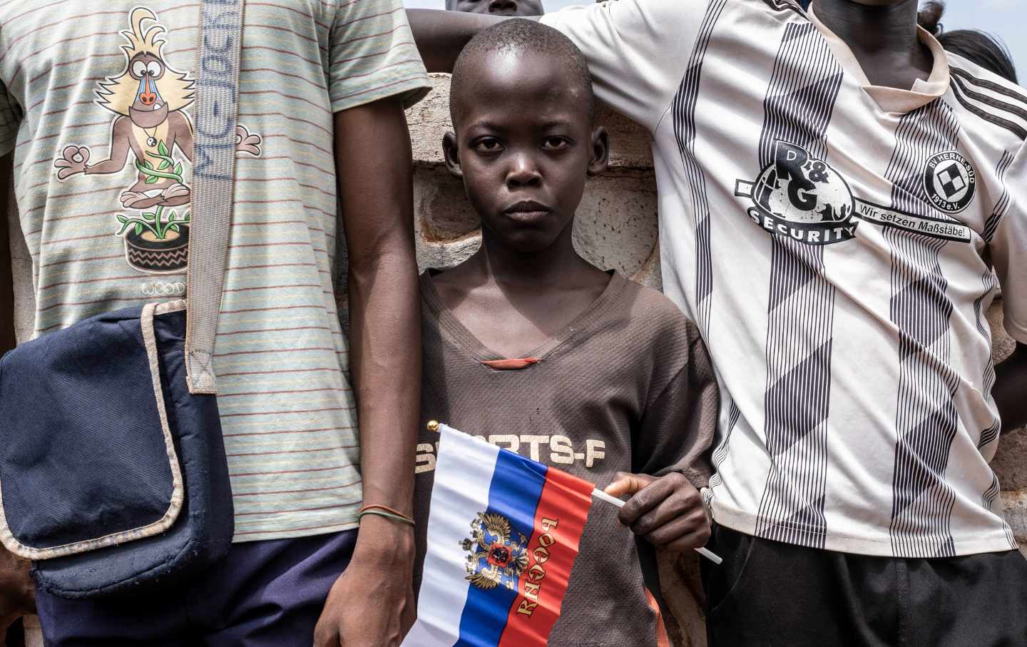 A child holds a flag at a demonstration in support of Russia and China's presence in the Central African Republic.