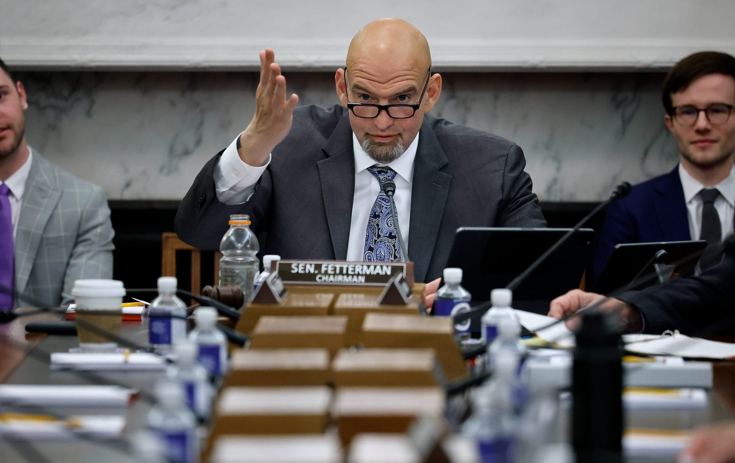 John Fetterman speaks at a table