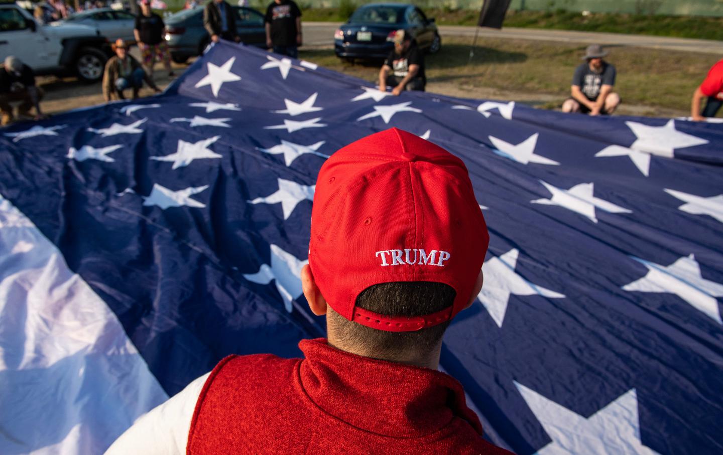 Trump supporters rally to welcome him at Manchester airport in Manchester, N.H., on May 10, ahead of his CNN town hall.