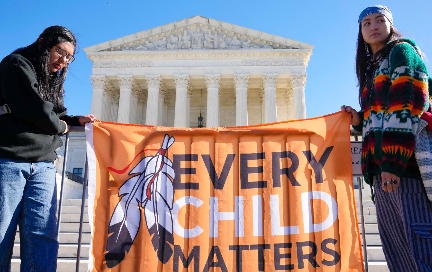 Demonstrators stand outside the US Supreme Court Building during oral arguments on Haaland v. Brackeen, a case challenging the Indian Child Welfare Act, on November 9, 2022.