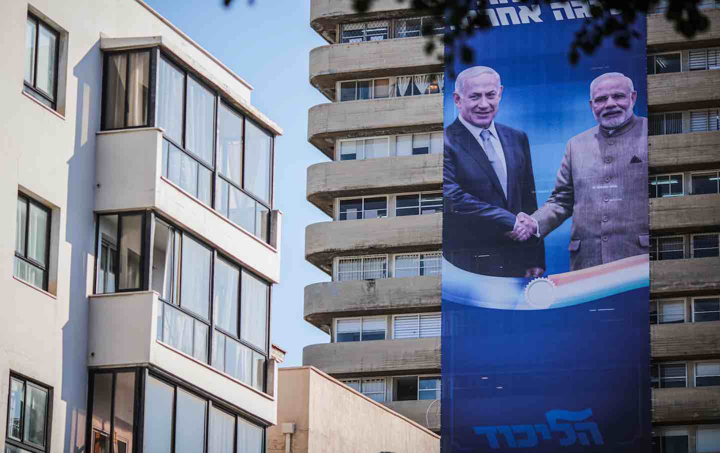 A banner depicting Israel Prime Minister Benjamin Netanyahu shaking hands with India Prime Minister Narendra Modi, 2019.