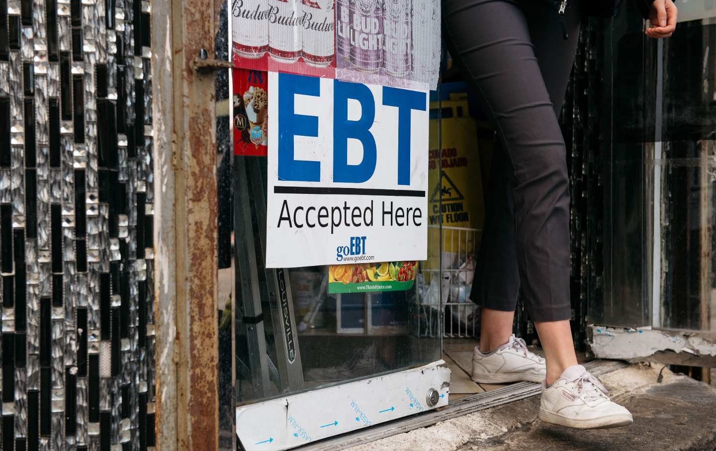 A sign on a bodega in Brooklyn reads, 