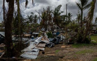 Homes in the Zero Down subdivision on Guam are reduced to piles of tin and wood debris leaving them unrecognizable in the wake of Typhoon Mawar.