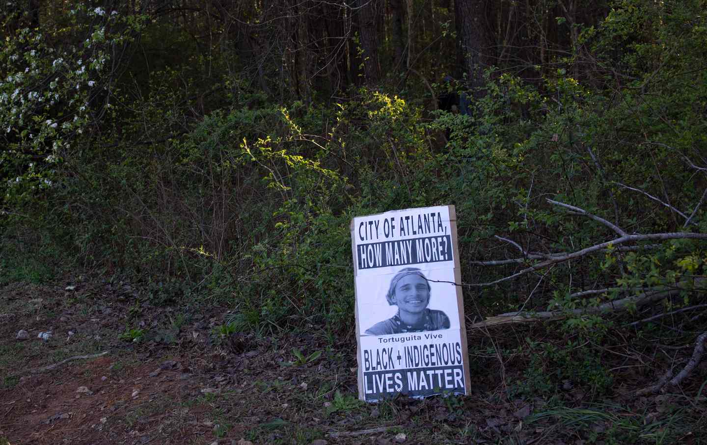A sign memorializing Tortuguita, the environmental activist killed by Georgia state troopers in Atlanta in January.
