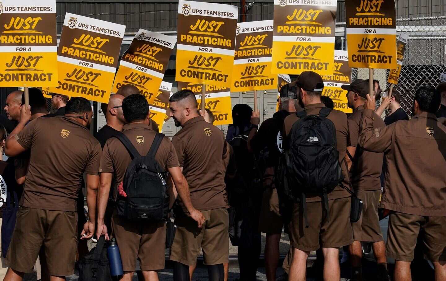 United Parcel Services (UPS) workers walk a “practice picket line” on July 7, 2023, in the Queens borough of New York City, ahead of the UPS strike.