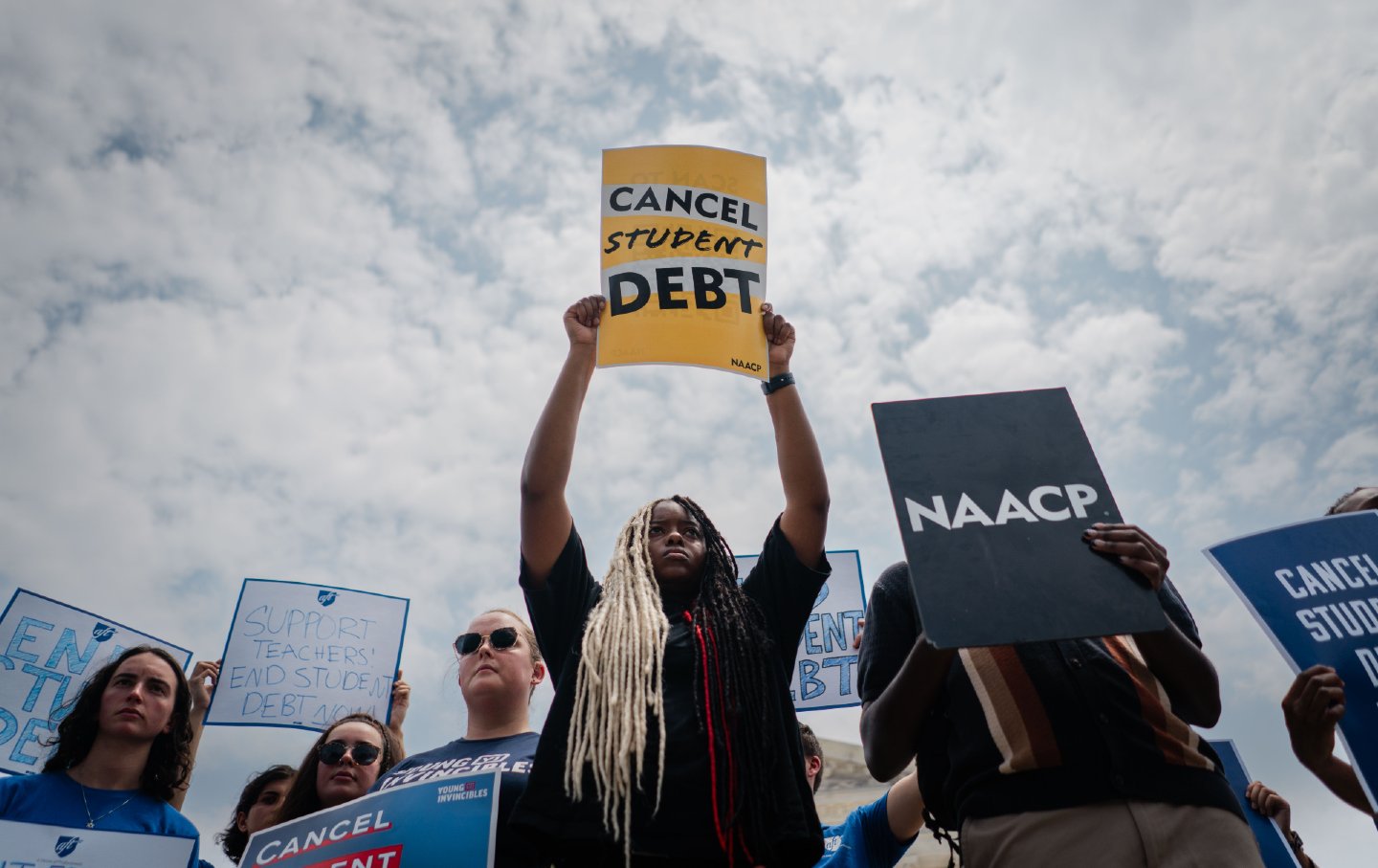 Protester holding a sign that reads 