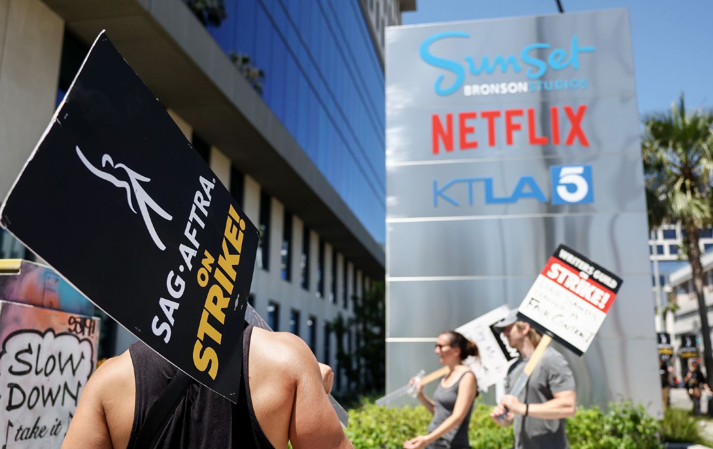 Striking SAG-AFTRA member in front of Netflix building