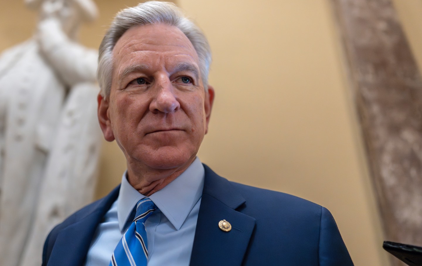 Sen. Tommy Tuberville looks into the distance at the Capitol