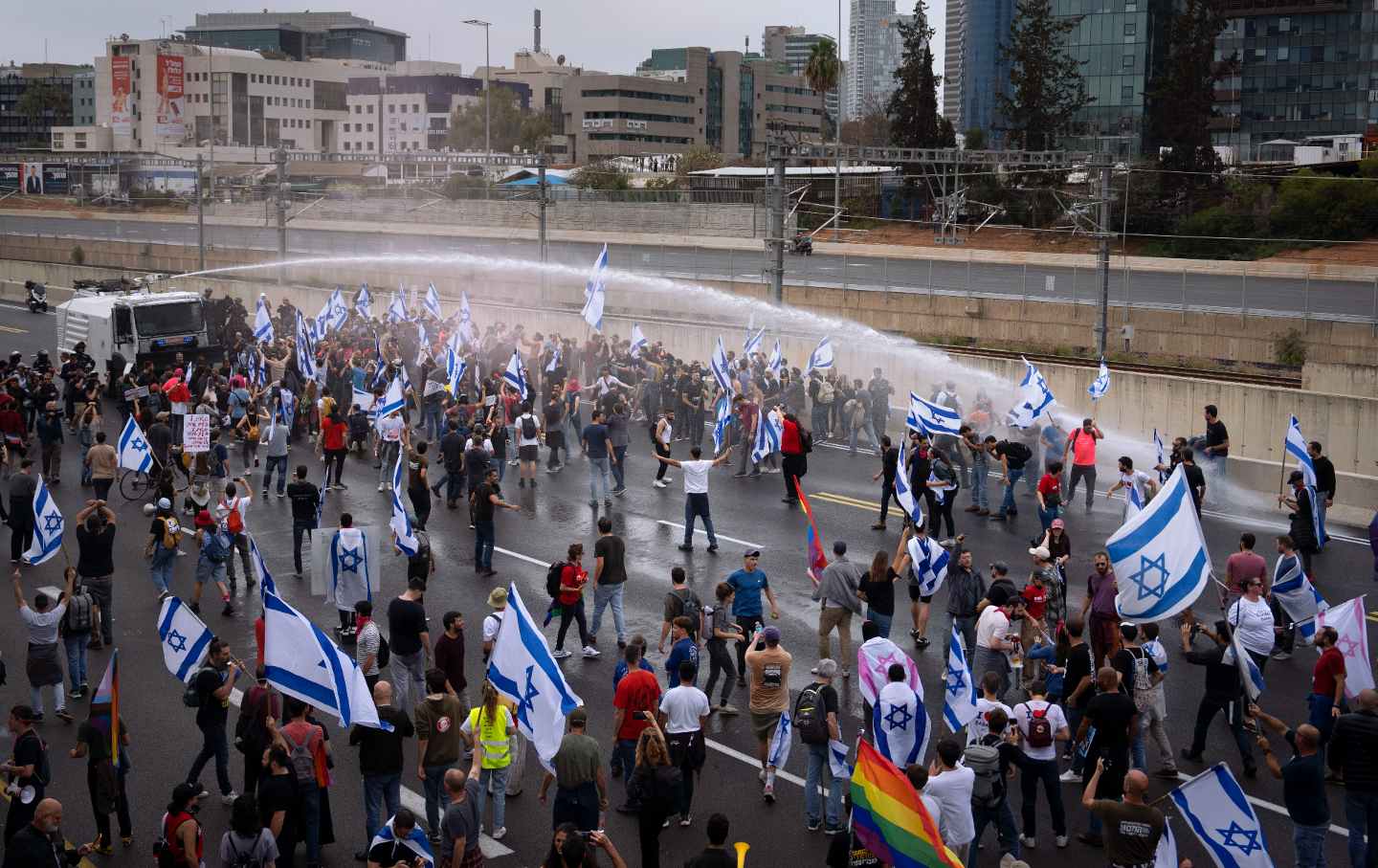 Israeli police use a water cannon to disperse Israelis blocking the freeway during a protest against plans by Prime Minister Benjamin Netanyahu's government to overhaul the judicial system in Tel Aviv, Israel on March 23, 2023.