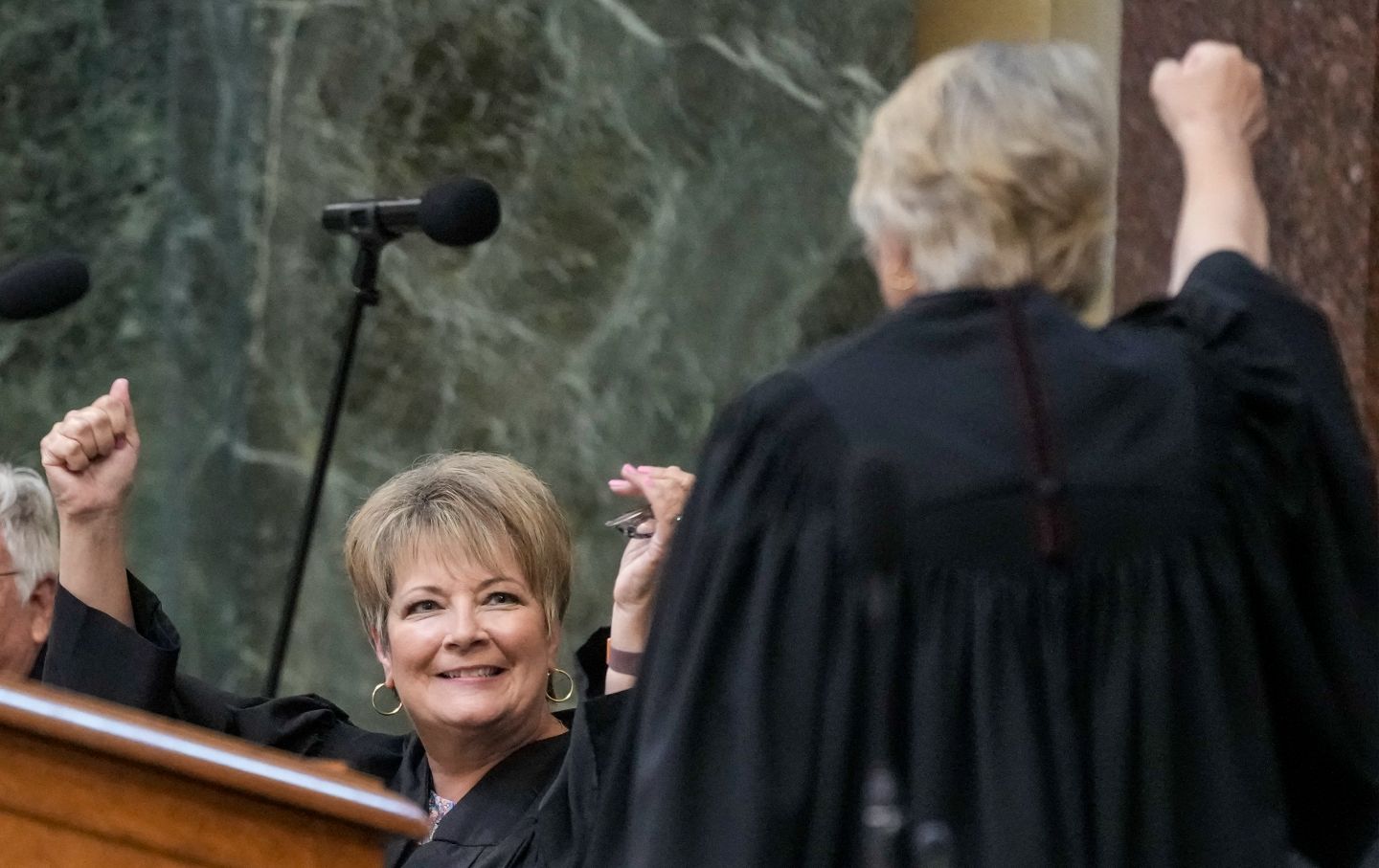 Janet Protasiewicz, left, celebrates with Supreme Court Justice Ann Walsh Bradley before being sworn in as a Wisconsin Supreme Court justice, Tuesday, Aug. 1, 2023, in Madison, Wis.