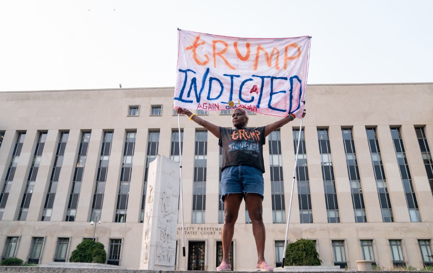 A demonstrator stands outside the Barrett Prettyman Courthouse in Washington, D.C., on August 1, 2023, the day of former president Donald Trump’s indictment related to his efforts to overturn the results of the 2020 election.