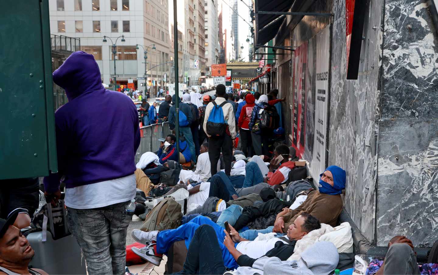 Hundreds of migrants are seen outside the Roosevelt Hotel in Midtown Manhattan early Wednesday, August 2, 2023