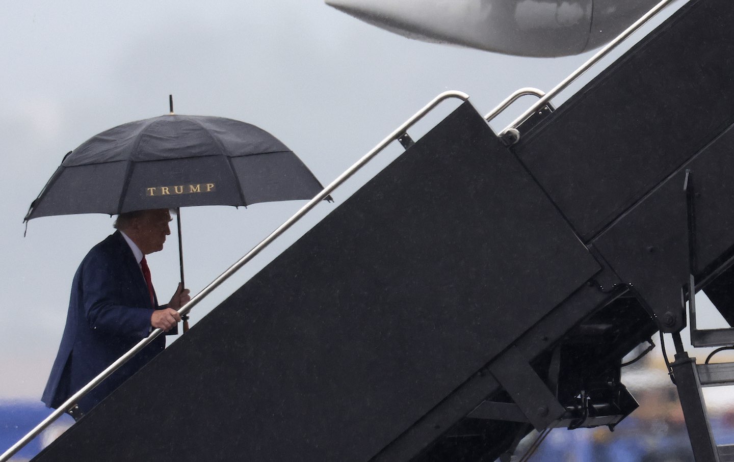 Donald Trump boards his plane at Reagan National Airport following his arraignment in Washington, D.C. federal court on August 3, 2023, in Arlington, Va.