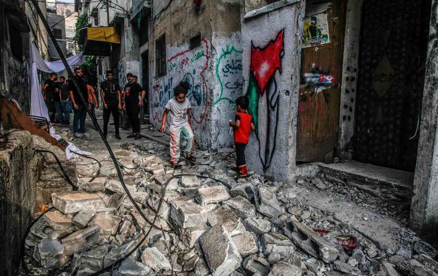 Palestinians inspect the damage after Israeli forces stormed the Balata refugee camp, east of Nablus, in the northern West Bank.