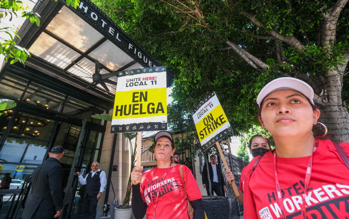 Striking hotel workers hold placards expressing their opinion outside the Hotel Figueroa, in downtown Los Angeles.
