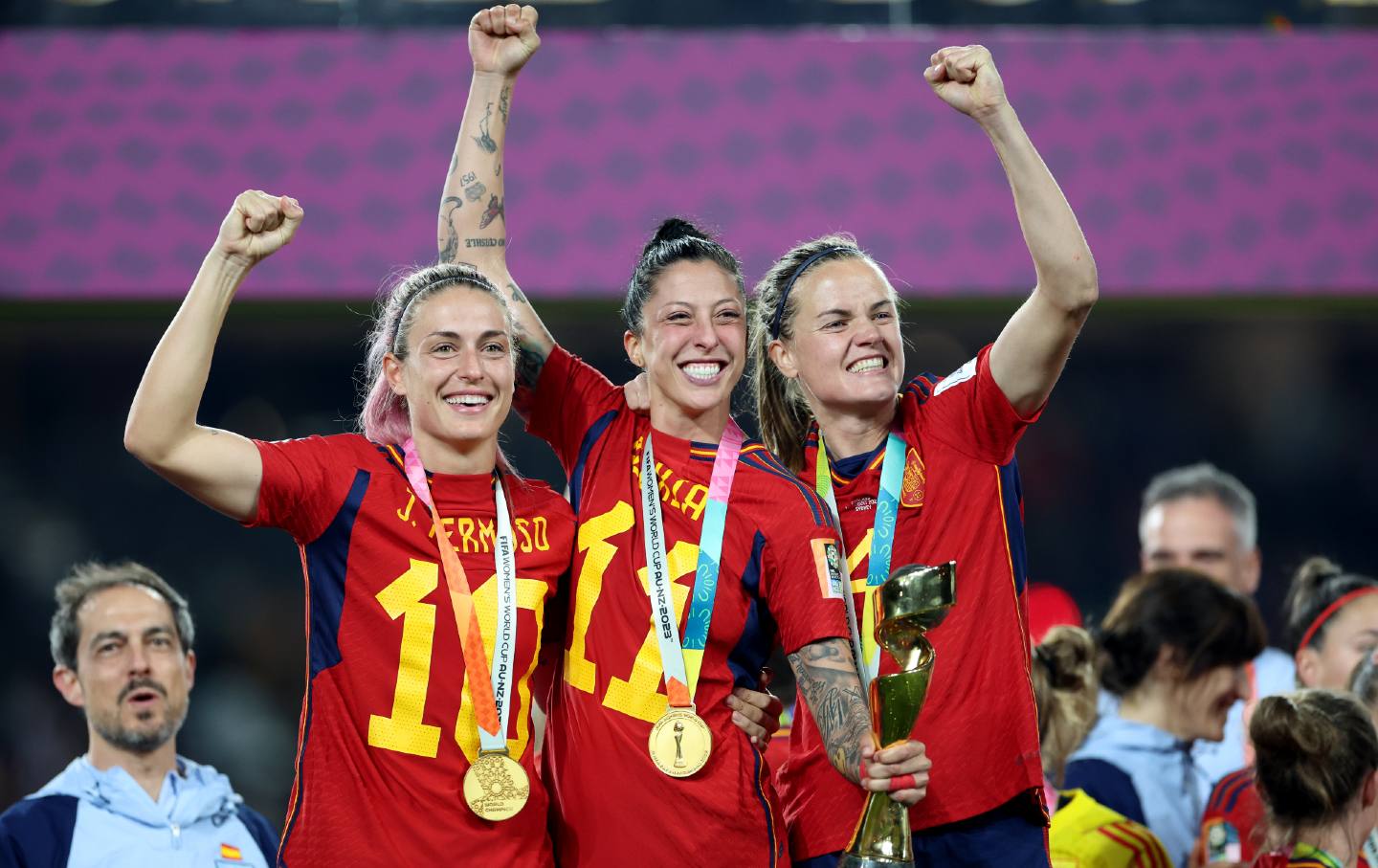 Jenni Hermoso, Alexia Putellas, and Irene Paredes of the spain women's soccer team pump fists in the air, celebrate after winning the 2023 women's world cup
