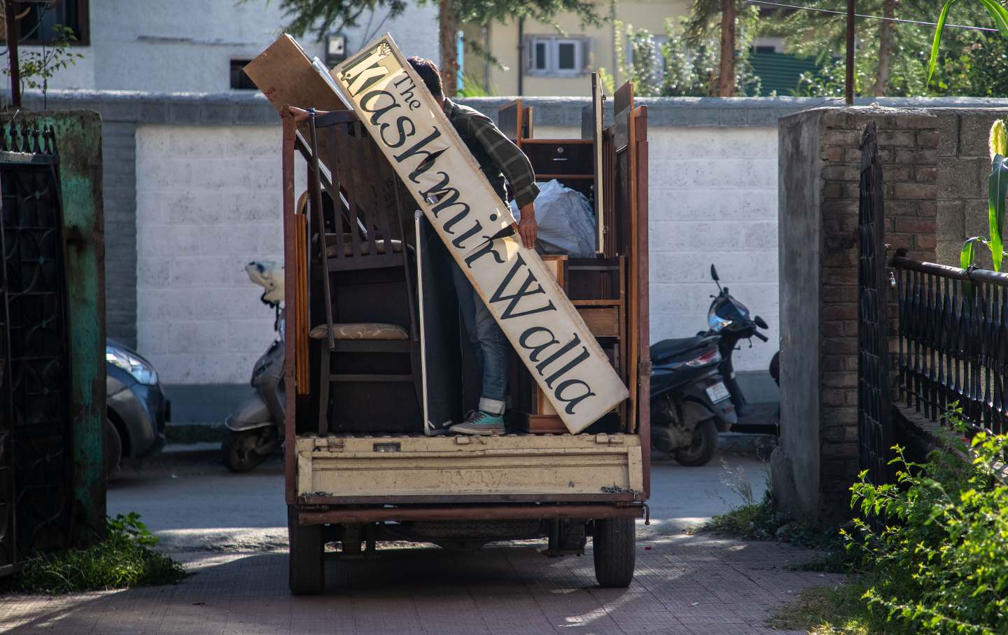 A vehicle carries office furniture of The Kashmir Walla while vacating its office in Kashmir capital Srinagar as they have been served notice by the landlord after their website and social media has been blocked in India under the Information Technology Act, 2000, by the government of India, according to statement published by the news website, a regional prominent independent news organisation based in Srinagar Kashmir, founded in 2009 by founder-editor Fahad Shah, who is currently in jail for 18 months over press coverage of a gunfight.