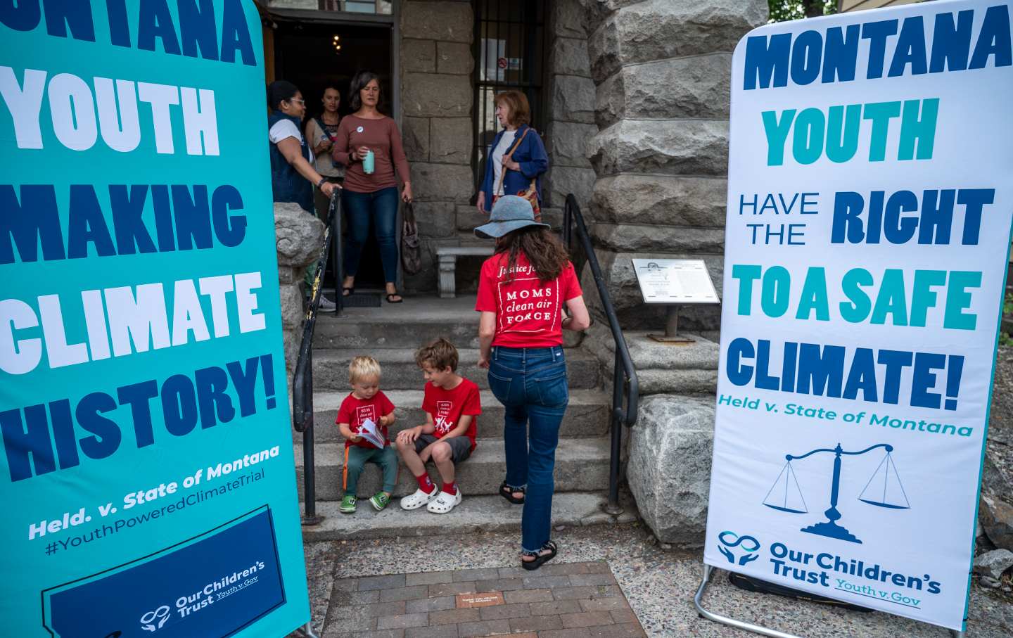 Supporters gather at a theater next to the Helena, Mont., courthouse on June 12, 2023, to watch the court proceedings for the nation's first youth climate change trial at Montana's First Judicial District Court. Sixteen plaintiffs, ranging in age from 6 to 22, are suing the state for promoting fossil fuel energy policies that they say violate their constitutional right to a “clean and healthful environment.”