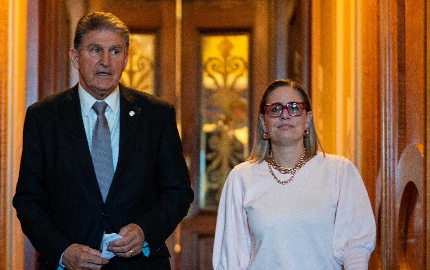 Sen. Joe Manchin (D-WV) leaves the Senate Chamber with Sen. Kyrsten Sinema (D-AZ) following a vote in the Senate at the U.S. Capitol Building on Wednesday, Nov. 3, 2021