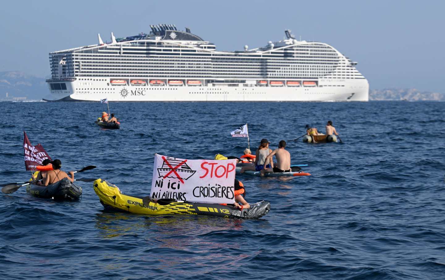 - Activists from the "Stop croisieres" NGO hold a banner reqding "Not here nor elsewhere, stop cruises" from a kayak during a demonstration against cruise ships as the MSC World Europa leaves Marseille's harbour, southern France, on June 17, 2023.