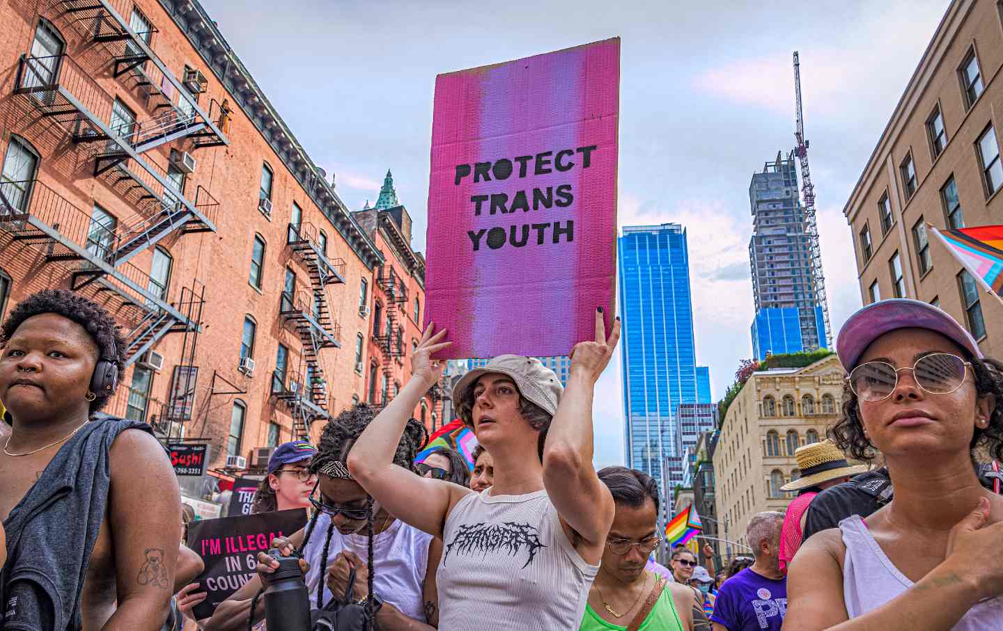 Participant seen holding a sign reading "Protect Trans Youth" at the Queer Liberation March on June 25, 2023 in New York City.