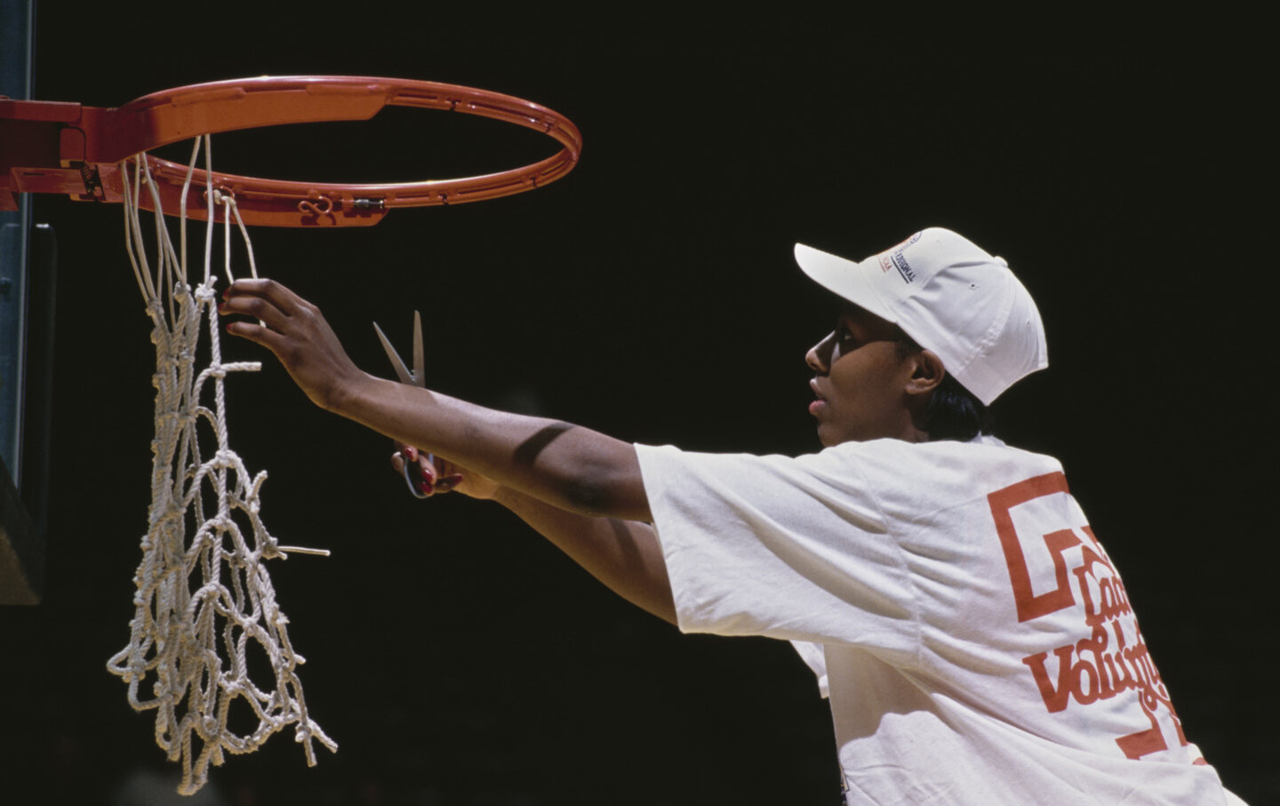 Chamique Holdsclaw #23, Forward for the Tennessee Lady Volunteers cuts the net on the backboard hoop to celebrate winning the NCAA Division I Women’s Basketball Midwest Regional Tournament Final game against the University of Connecticut UConn Huskies on March 24, 1997, at the Carver-Hawkeye Arena, Iowa City, Iowa.