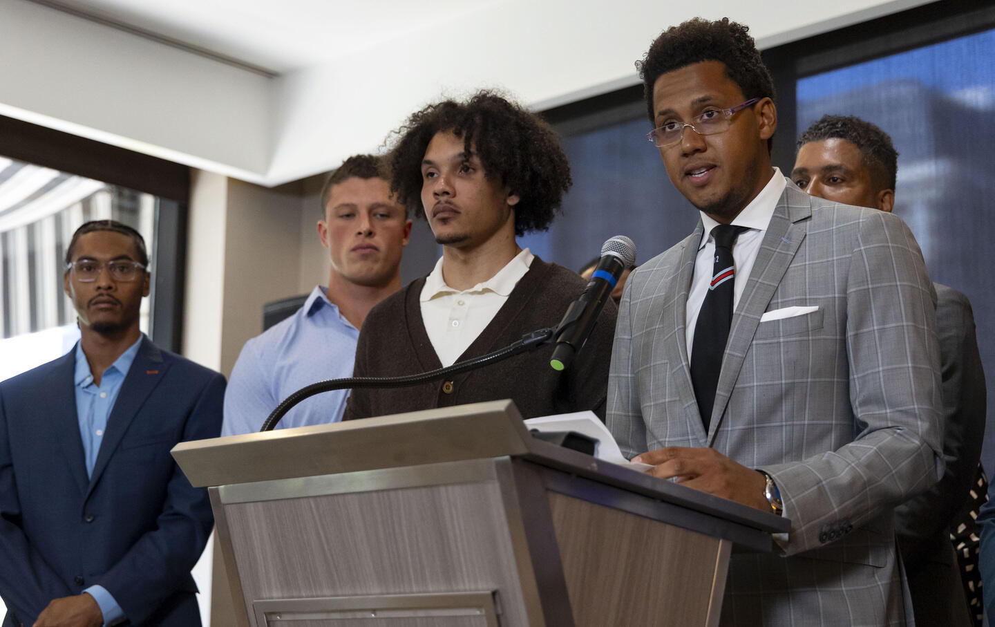 Former Northwestern football player Lloyd Yates speaks Wednesday, July 19, 2023, alongside other former players, from left, Warren Miles Long, Tom Carnifax, and Simba Short about the abuse and hazing they say occurred in the program.