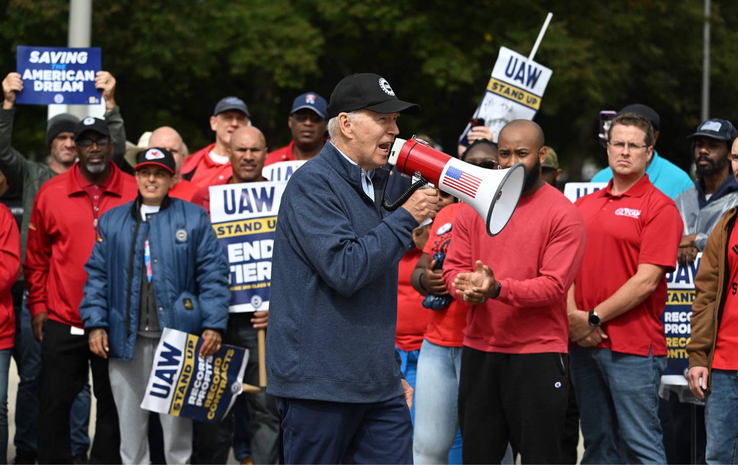 Joe Biden addresses striking members of the United Auto Workers (UAW) union at a picket line outside a General Motors Service Parts Operations plant in Belleville, Michigan, on September 26, 2023.