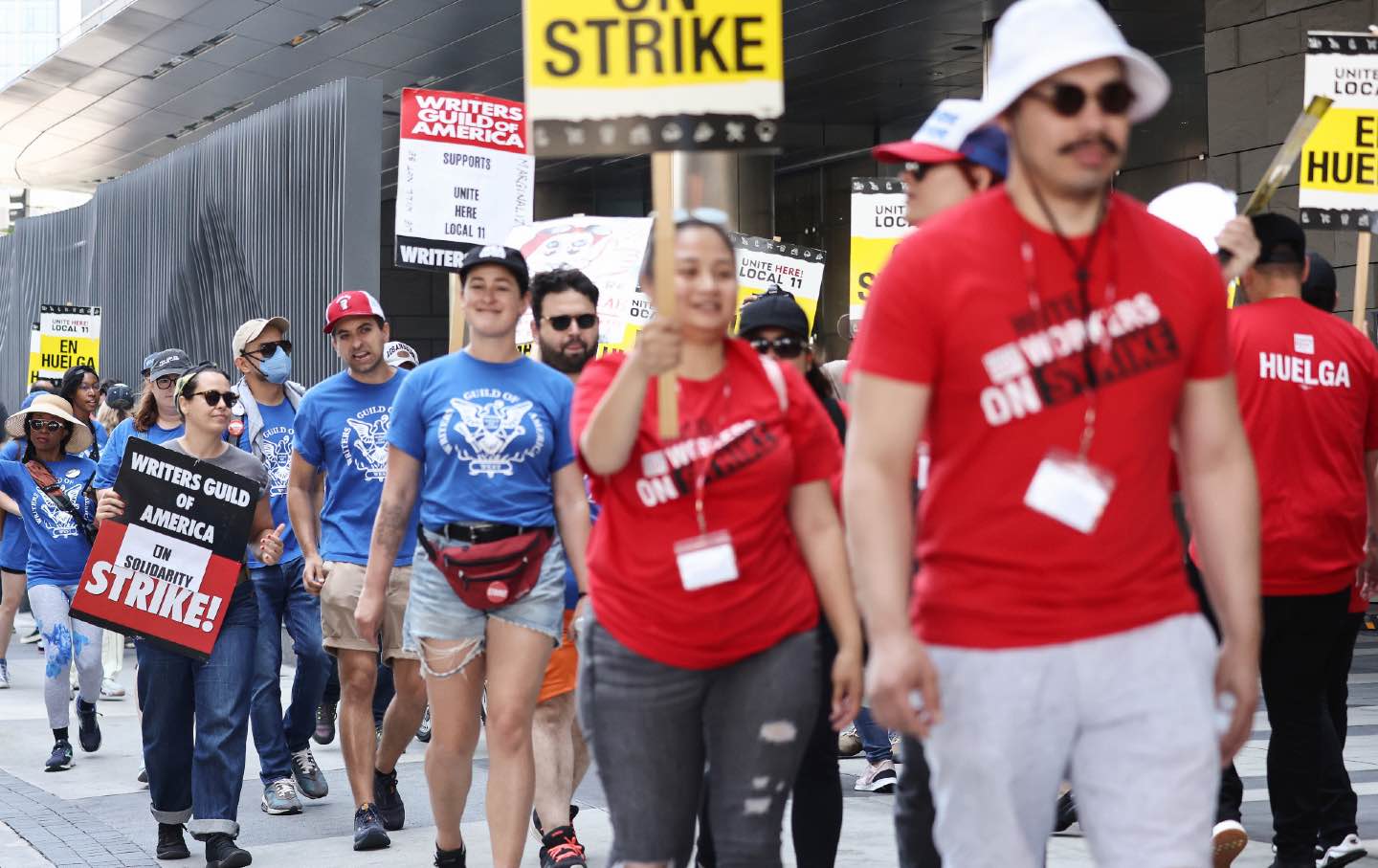 wga picketers hold signs