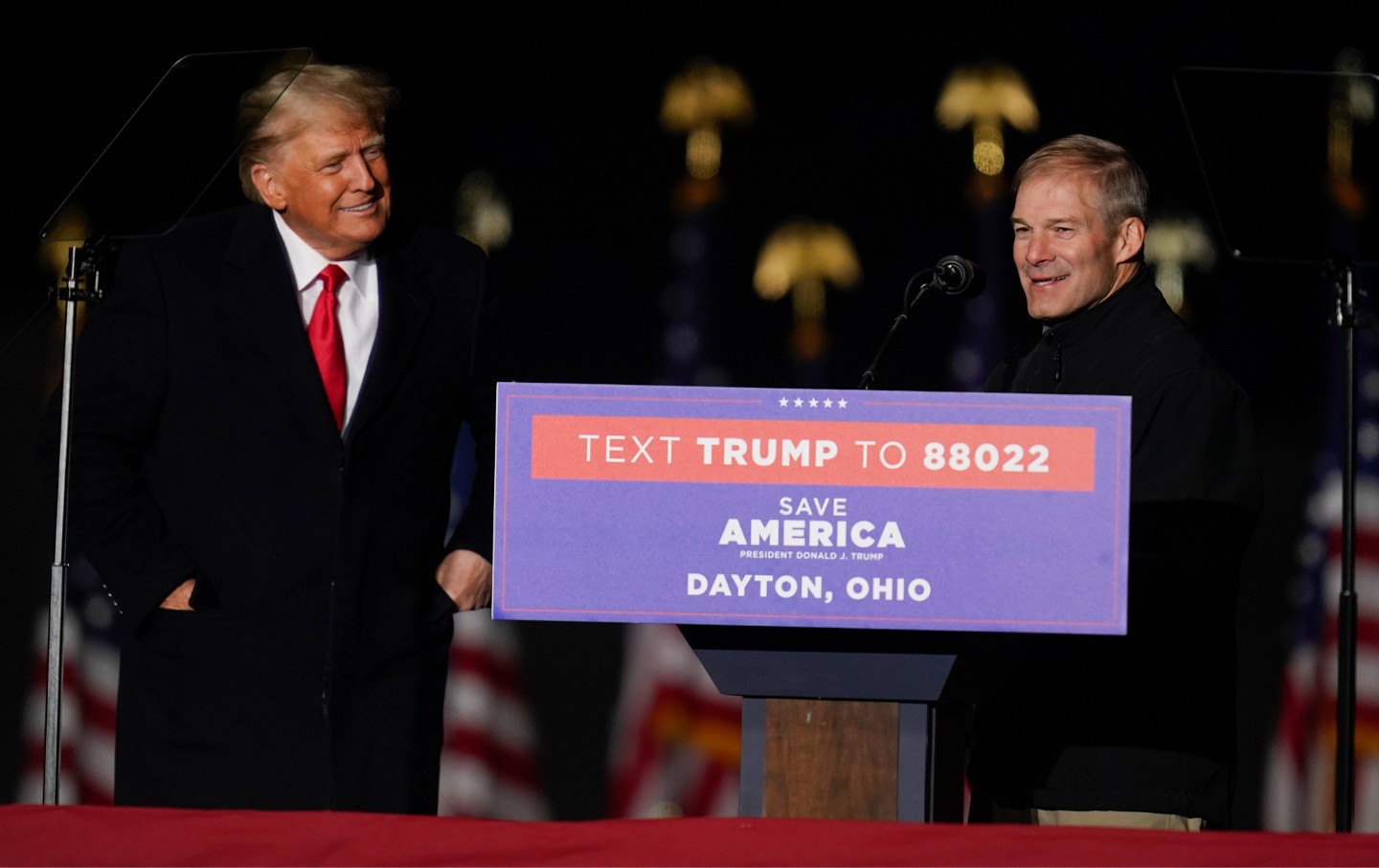 Former president Donald Trump welcomes Representative Jim Jordan (R-Ohio) to the stage at a campaign rally in support of the campaign of Ohio Senate candidate J.D. Vance at Wright Bros. Aero Inc. at Dayton International Airport on Monday, November 7, 2022, in Vandalia, Ohio. (AP Photo/Michael Conroy)
