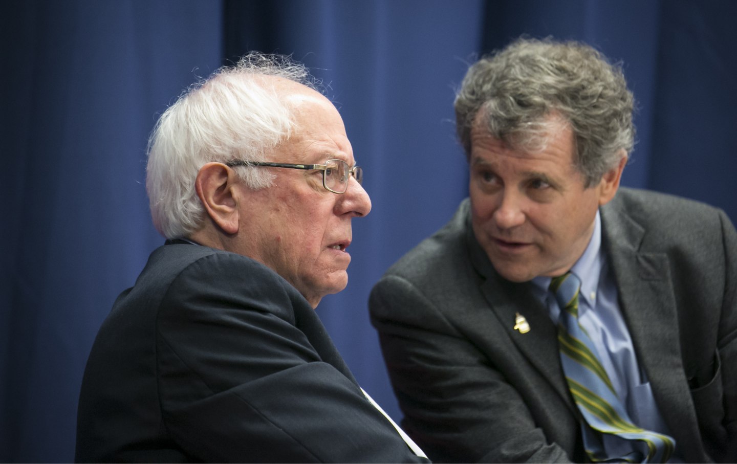 Senator Bernie Sanders, an Independent from Vermont and 2020 presidential candidate, left, listens as Senator Sherrod Brown, a Democrat from Ohio, speaks during the Martin and Coretta King Unity Breakfast in Selma, Alabama, U.S., on Sunday, March 3, 2019.