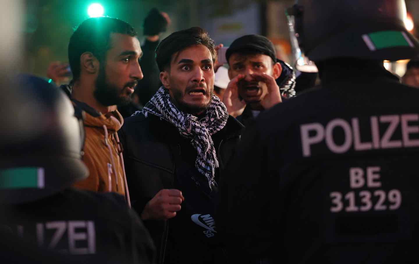 A protester confronts riot police at a gathering of pro-Palestinian demonstrators on Sonnenallee in Neukoelln in Berlin, 2023.