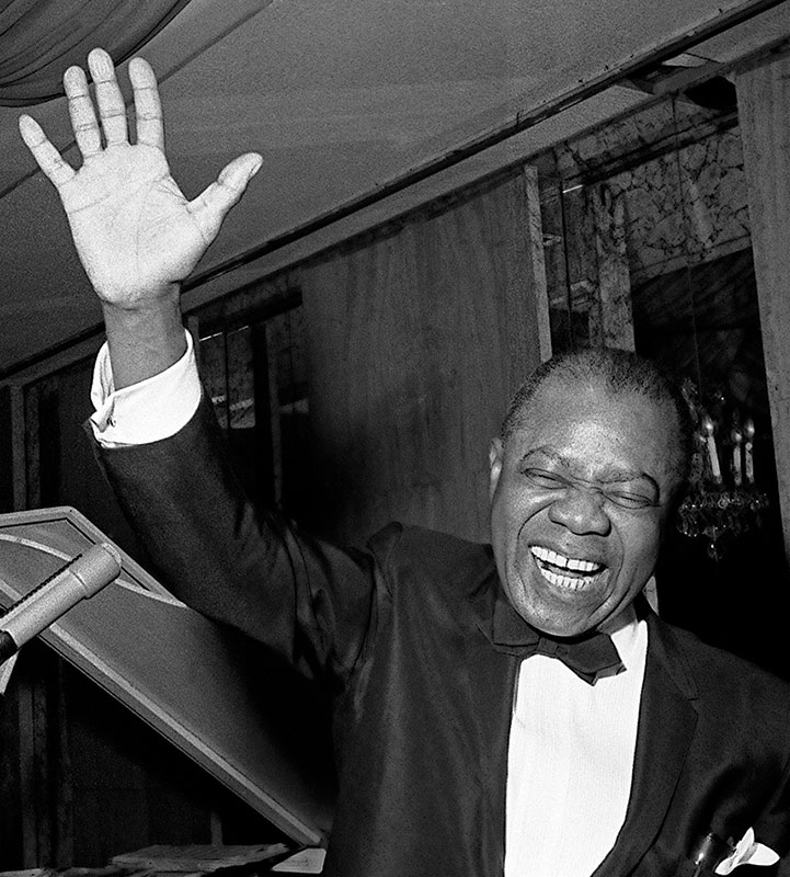 Armstrong waves to the crowd at a performance late in his life, in 1969 in New York City.