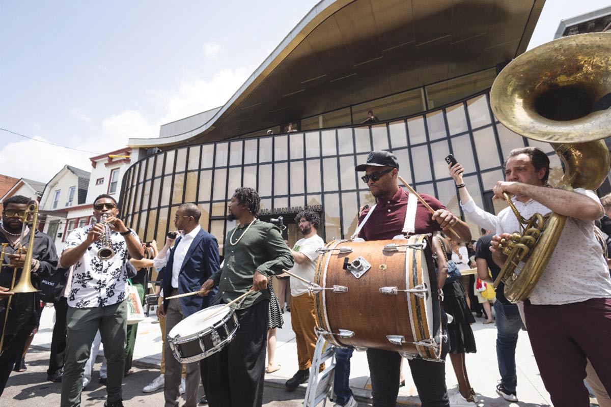 A performance outside the Louis Armstrong Center at its ribbon-cutting ceremony in June 2023.