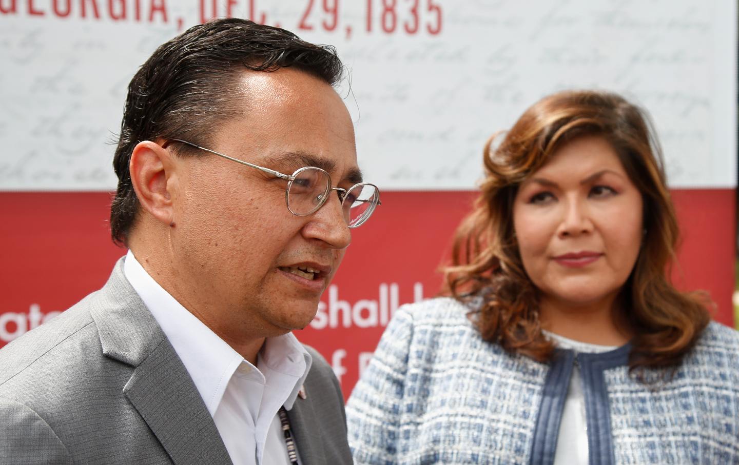 Cherokee Nation Principal Chief Chuck Hoskin Jr., left, answers a question for the media following his announcement that he is nominating Kimberly Teehee, right, as a Cherokee Nation delegate to the U.S. House, in Tahlequah, Okla., Thursday, Aug. 22, 2019.