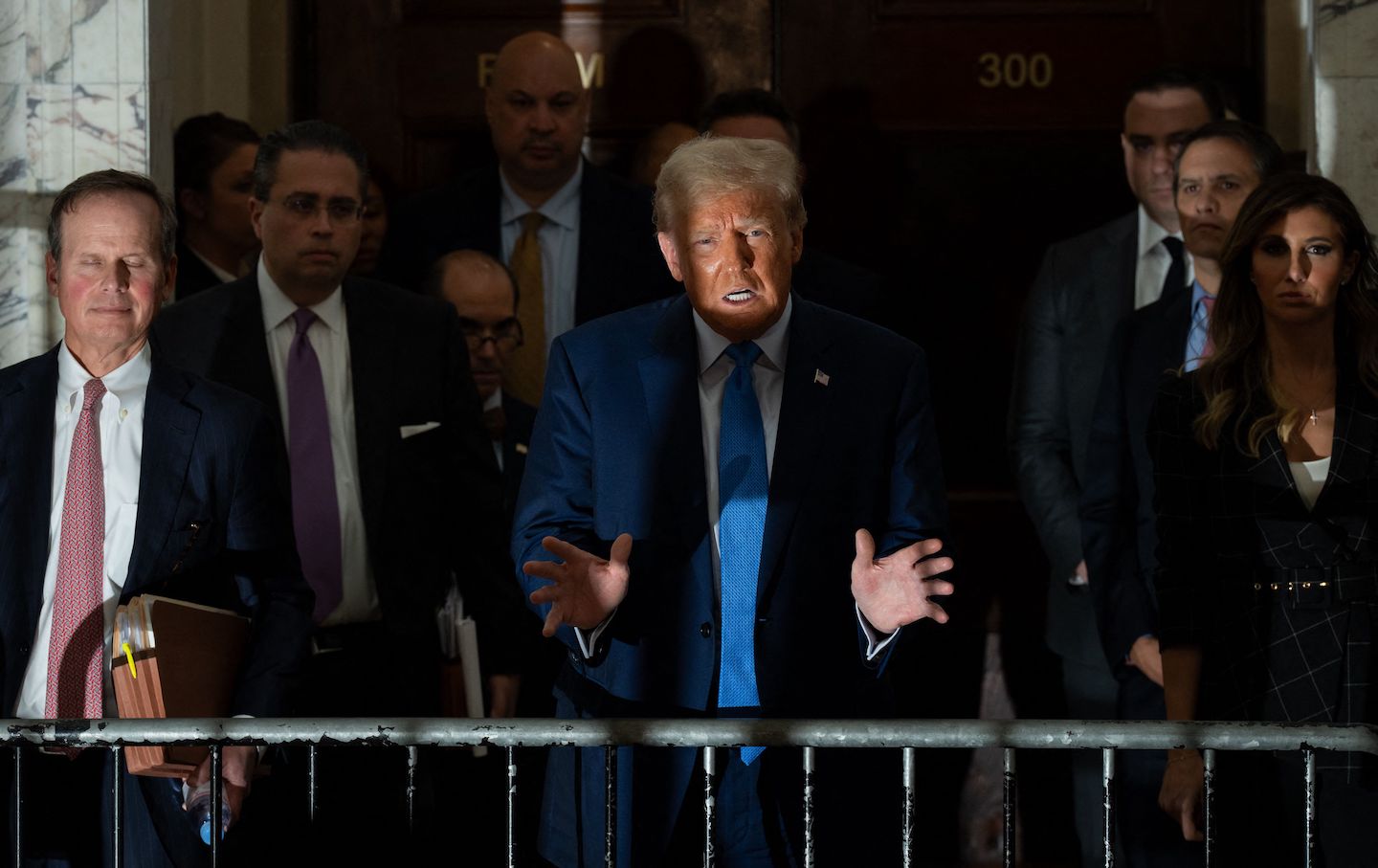 Former US president Donald Trump speaks to members of the media after testifying in his civil fraud trial at the New York State Supreme Court in New York City on November 6, 2023.