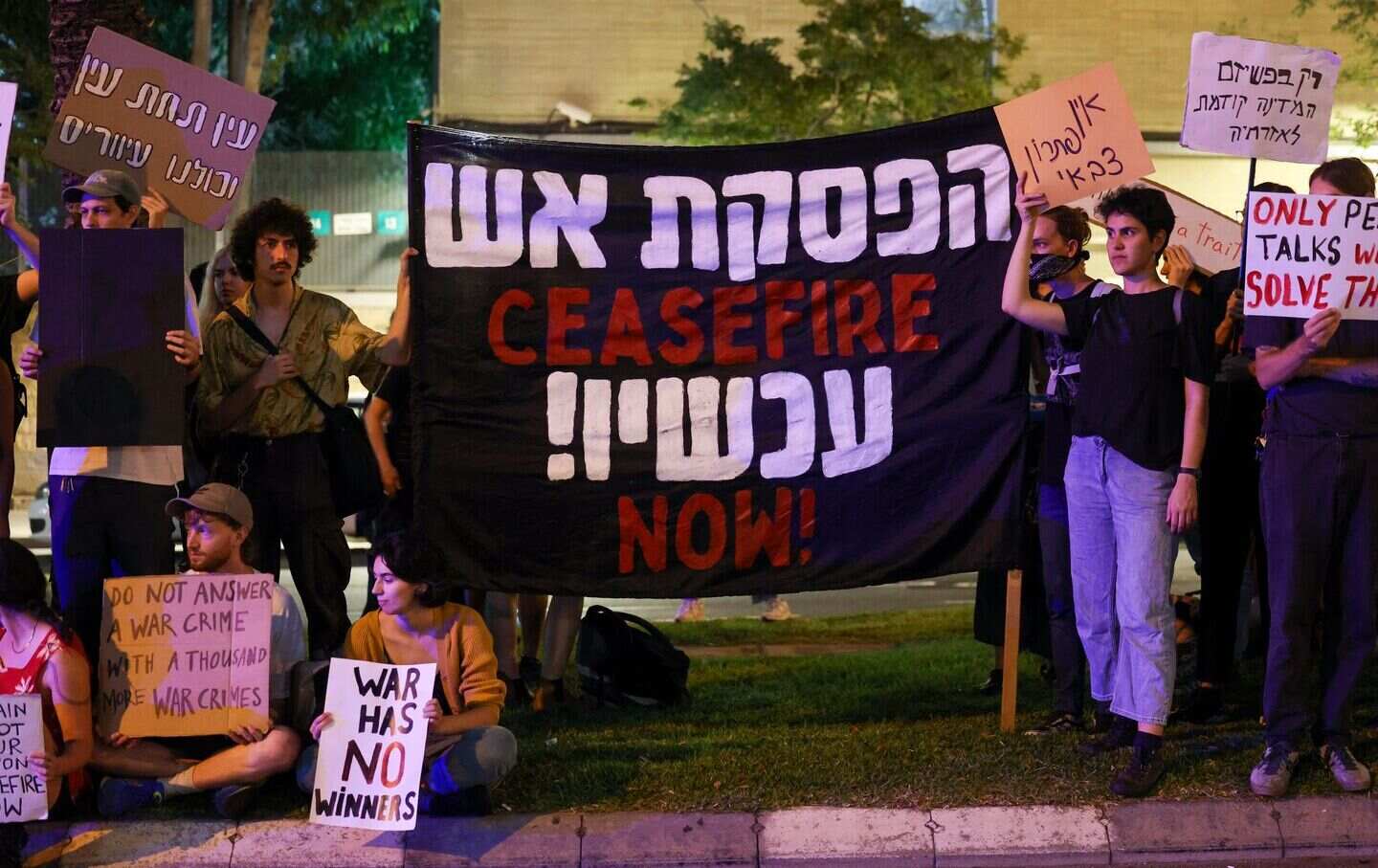 Israeli left-wing activists hold a demonstration near the Ministry of Defense in Tel Aviv on November 11, 2023, calling for a cease-fire amid ongoing battles between Israel and Hamas.