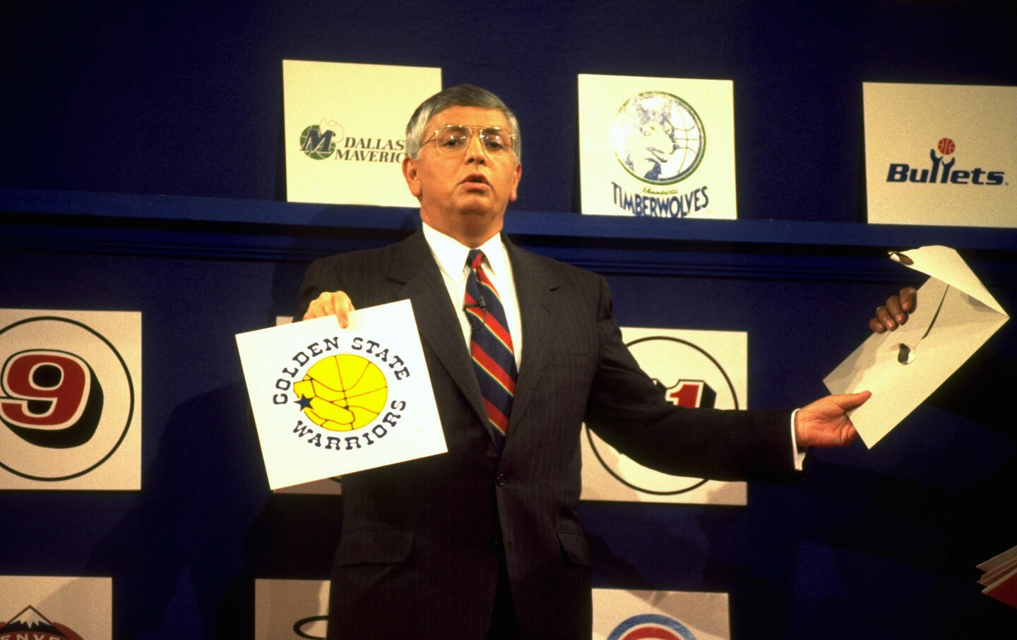 NBA Commissioner David Stern holding up Golden State Warriors card at Sherton New York Hotel and Towers in 1993.