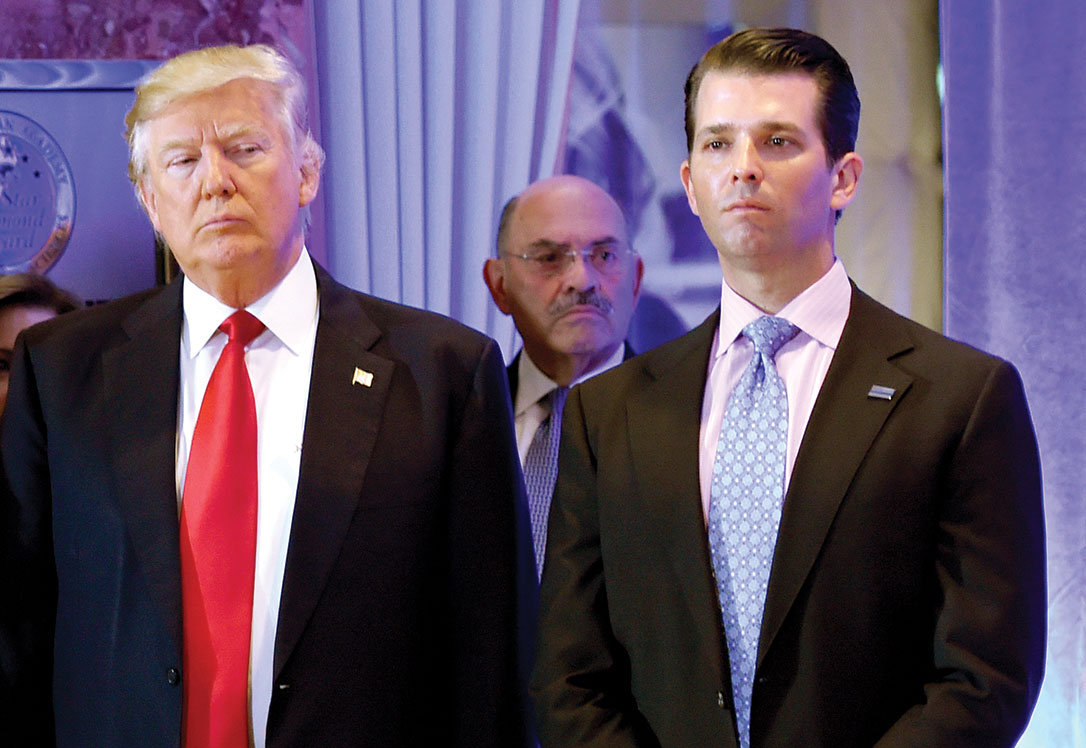 Donald Trump with his son, Donald Jr., with former Trump Organization CFO Allen Weisselberg in the background.