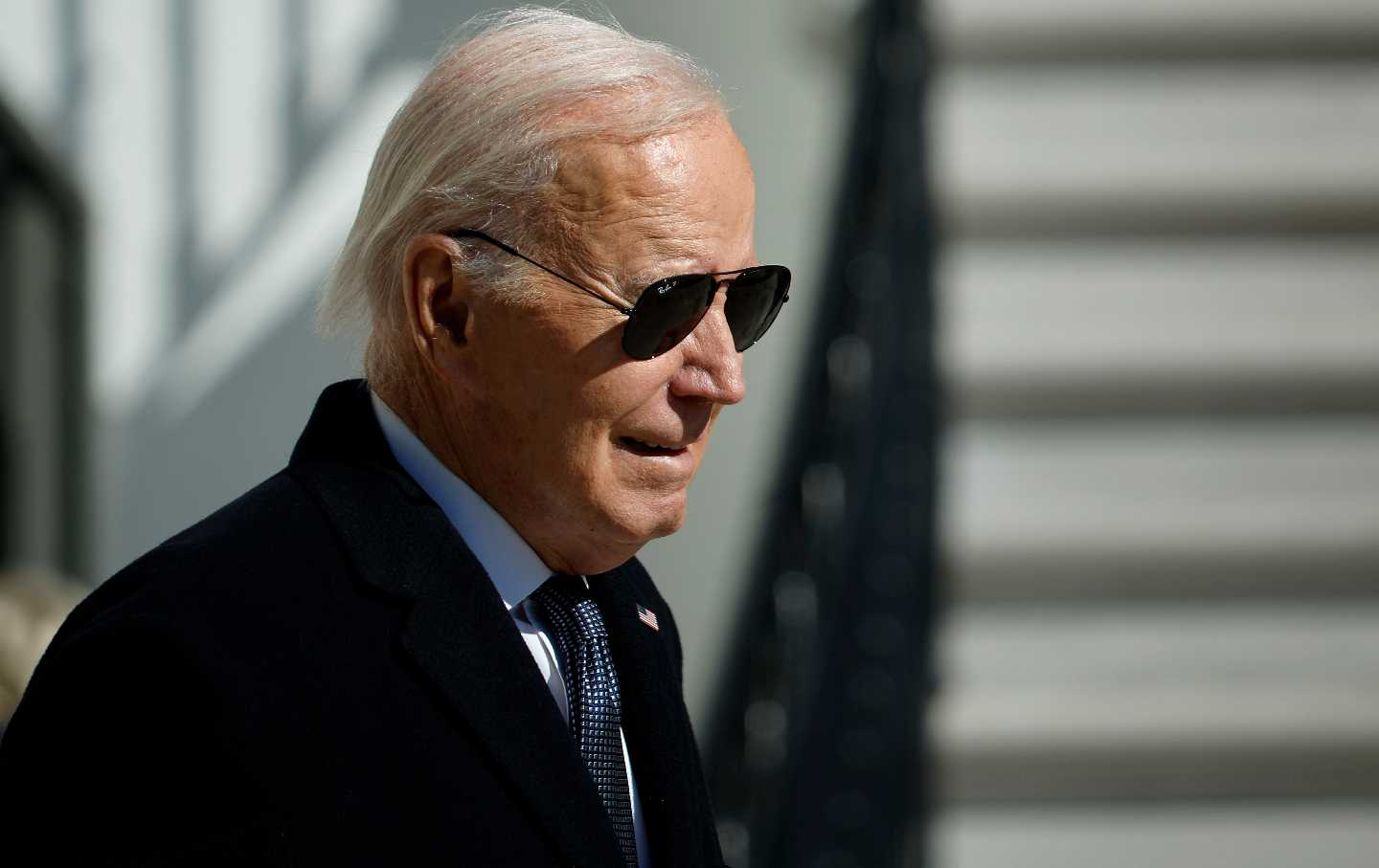 US President Joe Biden walks across the South Lawn of the White House.