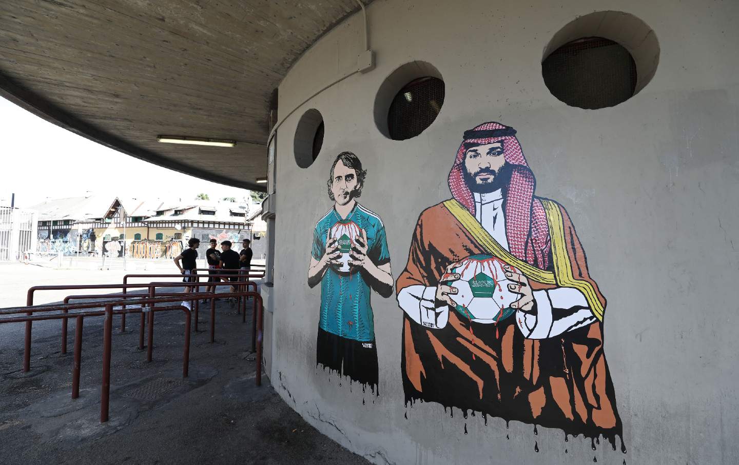 A mural depicting Roberto Mancini and Mohammed bin Salman painted by aleXsandro Palombo outside the San Siro Stadium at Stadio Giuseppe Meazza, September 19, 2023, in Milan, Italy.