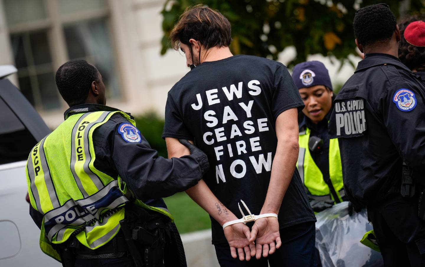 Demonstrators are detained by US Capitol Police after they staged a sit-in inside the Cannon House Office Building to demand a cease-fire against Palestinians in Gaza October 18, 2023, on Independence Avenue in Washington, DC.