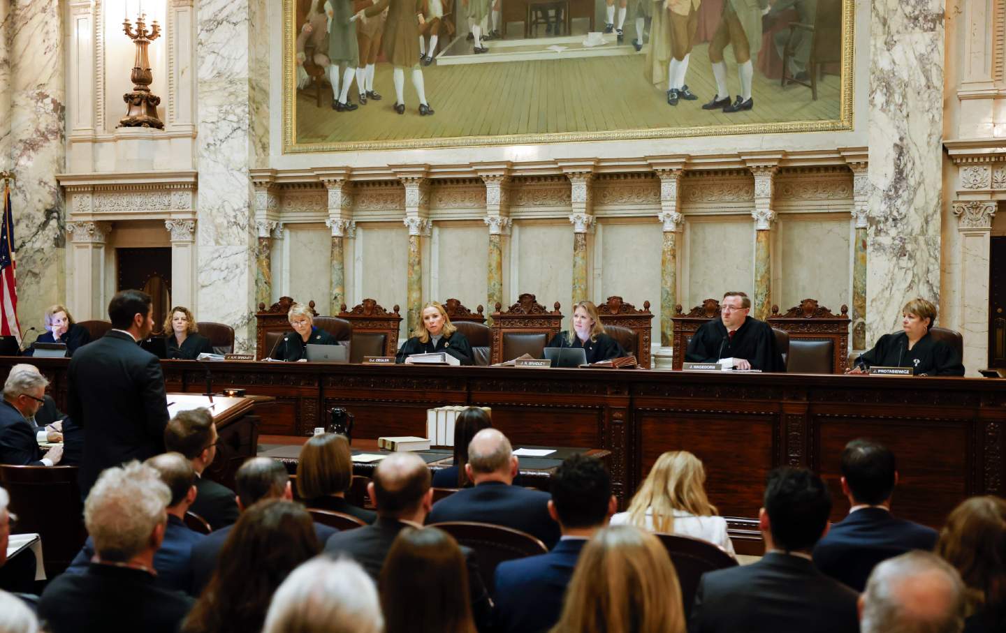 The Wisconsin Supreme Court listens to arguments from Wisconsin Assistant Attorney General Anthony D. Russomanno, representing Governor Tony Evers, during a redistricting hearing at the state capitol, November 21, 2023, in Madison, Wis.