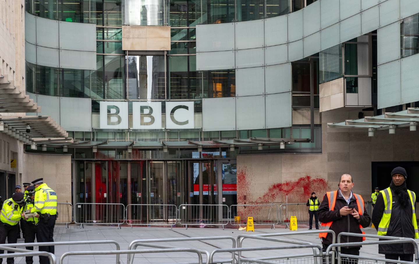 Security guards stand outside the BBC’s London headquarters, which pro-Palestine activists splashed with red paint in protest of the BBC's biased coverage of Israel’s attacks on Gaza.