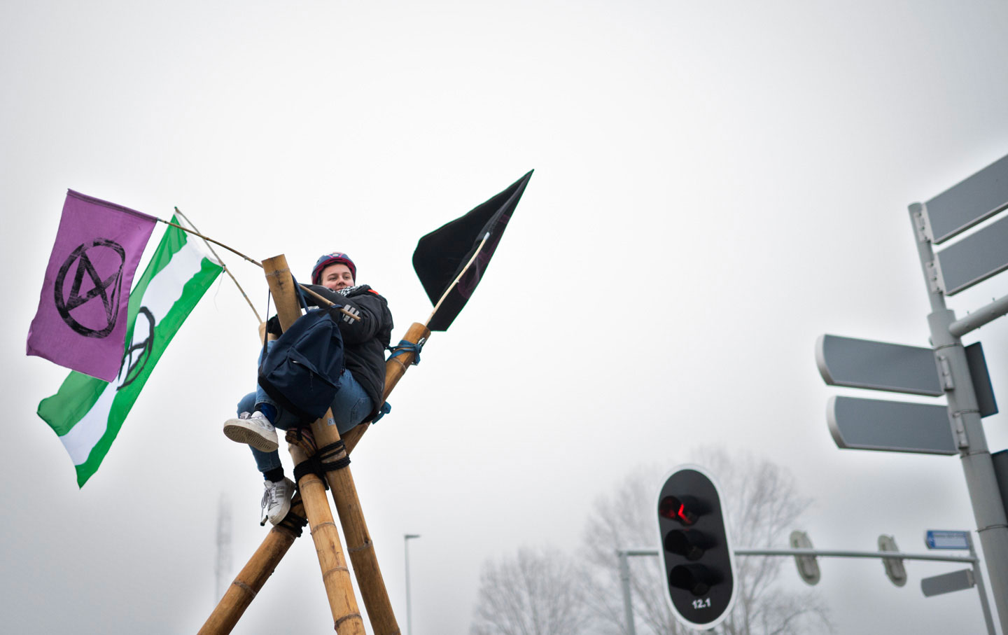 An Extinction Rebellion activist participates in an action to block traffic to the Port of Rotterdamn.