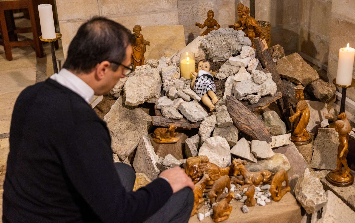 The Nativity scene shows baby Jesus wrapped in a keffiyeh and placed in a pile of rubble to show solidarity with the people of Gaza on December 18, 2023 in the Evangelical Lutheran Christmas Church in Bethlehem, West Bank.