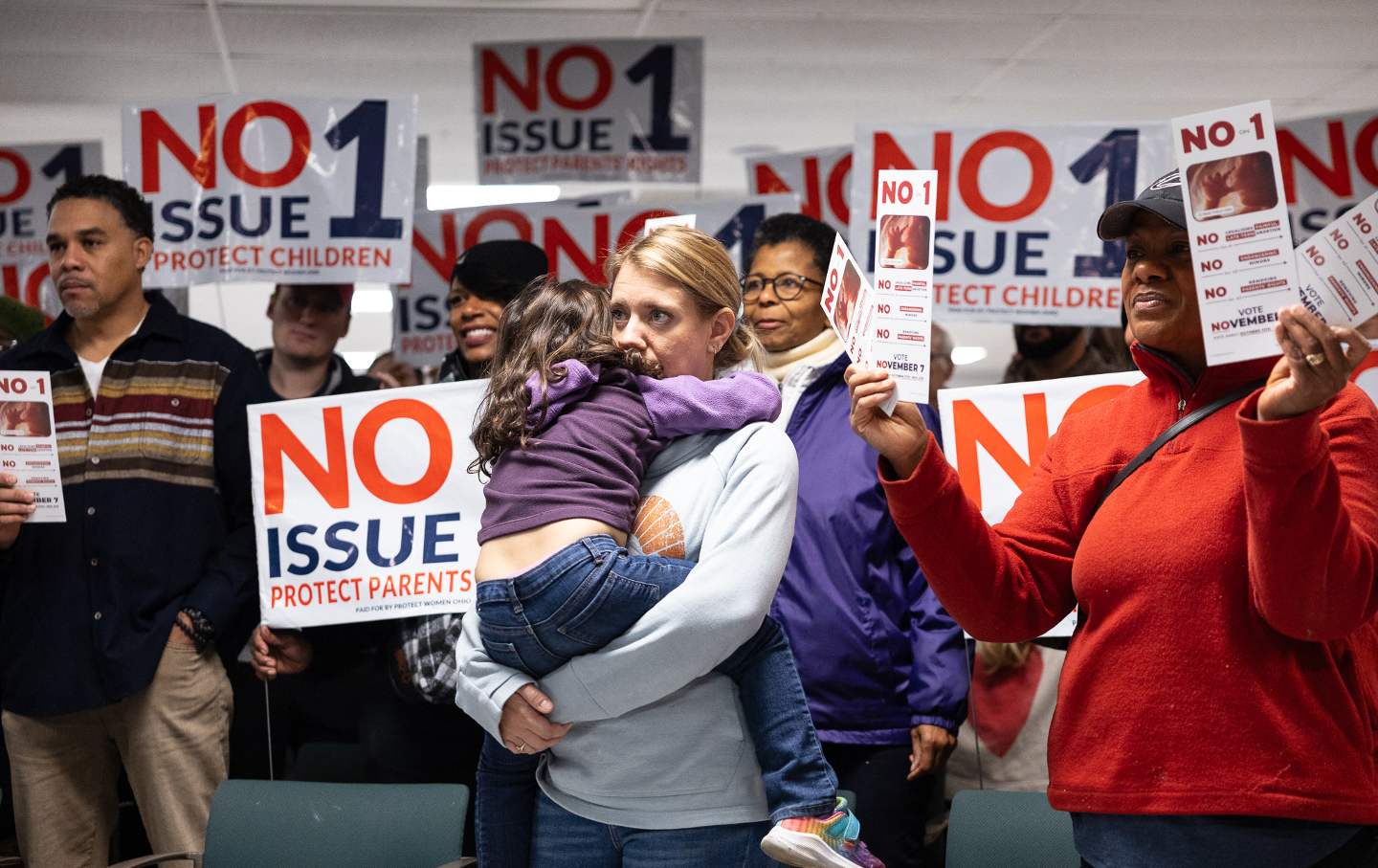 A large group of people holding 